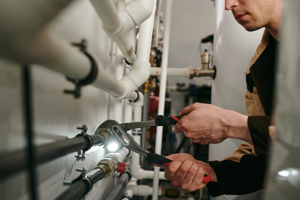 Plumbers maintaining commercial plumbing pipes in Philadelphia